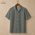 Men’s geometric-pattern cotton Hawaiian short-sleeve button-down shirt in blue, cream and yellow.
